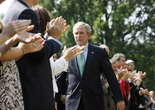President George W. Bush is applauded following his remarks highlighting the achievements of volunteerism and work of the USA Freedom Corps Monday, Sept. 8, 2008, on the South Lawn of the White House. White House photo by Eric Draper