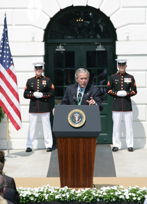 President George W. Bush gestures as he addresses his remarks highlighting the achievements of the USA Freedom Corps and honoring volunteerism Monday, Sept. 8, 2008, on the South Lawn of the White House. White House photo by Eric Draper