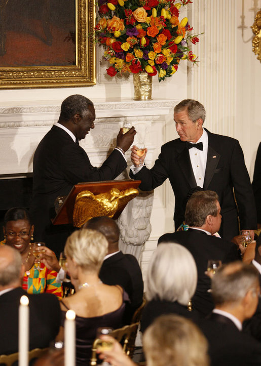 President George W. Bush and President John Agyekum Kufuor of Ghana tip their glasses in a toast during a White House State Dinner Monday, Sept. 15, 2008, in honor of President Kufuor and Mrs. Theresa Kufuor. White House photo by Eric Draper