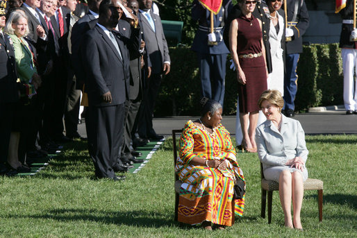 Mrs. Laura Bush and Ghana's first lady Theresa Kufuor sit together on the South Lawn of the White House during the South Lawn Arrival Ceremony Monday, Sept. 15, 2008, on the South Lawn of the White House. White House photo by Chris Greenberg