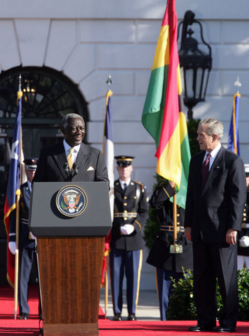President George W. Bush smiles as President John Agyekum Kufuor of Ghana delivers remarks Monday, Sept. 15, 2008, during the South Lawn Arrival Ceremony for President Kufuor and Mrs. Theresa Kufuor of Ghana on the South Lawn of the White House. White House photo by Chris Greenberg
