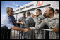 President George W. Bush shakes hands of military personnel outside the emergency operations center at the U.S. Coast Guard Hangar at Ellington Field in Houston Tuesday, Sept. 16, 2008, during his visit to Texas to see firsthand the destruction left in the wake of last weekend's Hurricane Ike. White House photo by Eric Draper
