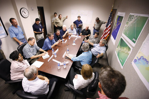 President George W. Bush speaks with state and local officials during a briefing Tuesday, Sept. 16, 2008, at the Galveston emergency operations center. The President spent the day in Texas visiting the areas hardest hit by Hurricane Ike, which made landfall September 13 near Galveston as a Category 2 storm with sustained winds of 110 miles per hour. White House photo by Eric Draper