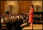 Mrs. Laura Bush welcomes a group of children to the East Room of the White House on Wednesday, Sept. 17, 2008, for an American history performance by the National Constitution Center to highlight the 221st anniversary of the signing of the United States Constitution. White House photo by Joyce N. Boghosian
