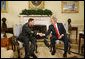 President George W. Bush and U.S. Army General David Petraeus, former Commander of the Multi-National Force in Iraq, shakehands Wednesday, Sept. 17, 2008, in the Oval Office at the White House. In speaking to reporters President Bush honored and congratulated General Petraeus for his outstanding command leadership in Iraq, and thanked him for agreeing to be the new commander of CENTCOM. White House photo by Eric Draper