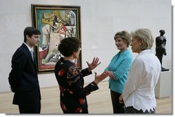 Mrs. Laura Bush stops in front of Pablo Picasso's painting 'Nude Man and Woman' as she is given a tour of the Nasher Sculpture Center by Acting Chief Curator Jed Morse, left, Trustee Nancy Nasher, gesturing, and Debbie Francis, right, Friday, Sept. 19, 2008 , in Dallas, Texas. White House photo by Chris Greenberg