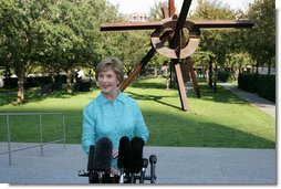 Mrs. Laura Bush addresses the media in the garden of the Nasher Sculpture Center at the conclusion of her tour of the new exhibit, Friday, Sept.19, 2008, in Dallas. Mrs. Bush said that the exhibit, which opened a few hours later, is in many ways about the relationships that Ray and Patsy Nasher had with the greatest artists of their generation - Picasso, Rodin, Oldenburg, Matisse and many others. The works had been in the Nasher home and are now at the center for enjoyment by the public.  White House photo by Chris Greenberg