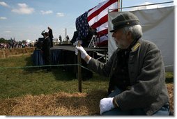 Vice President Dick Cheney delivers remarks during the cemmoration of the 145th anniversary of the Battle of Chickamauga in McLemore's Cove, Georgia. as a Confederate participant looks on. White House photo by David Bohrer
