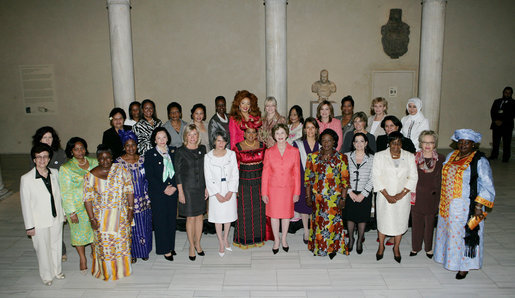 Mrs. Laura Bush, center in salmon-colored suit, hosts 36 other first ladies from around the world at the White House Symposium on Advancing Global Literacy at the Metropolitan Museum of Art in New York City, Sept. 22, 2008. The first ladies were in New York City while their spouses attend the United Nations General Assembly. White House photo by Chris Greenberg