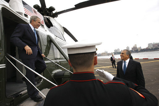 President George W. Bush is welcomed by United Nations U.S. Ambasador Dr. Zalmay Khalilzad as he arrives Monday, Sept. 22, 2008, aboard Marine One at the Wall Street helicopter landing area in New York City. President Bush will address the United Nations General Assembly on Tuesday. White House photo by Eric Draper