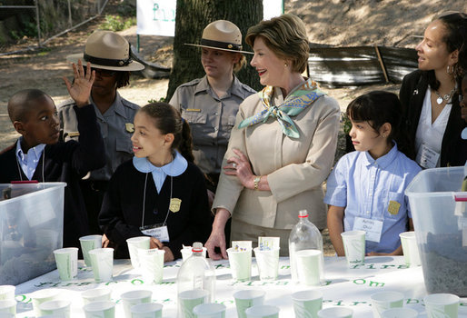 Mrs. Laura Bush and children from the Adam Clayton Powell Jr. Elementary School (P.S. 153) and the Boys and Girls Club of Harlem do 'cup planting' as part of the First Bloom program at the Hamilton Grange National Memorial in New York City, Sept. 24, 2008. The children will take care of the seedlings in the cups throughout the winter and plant them in the park in the spring. White House photo by Chris Greenberg