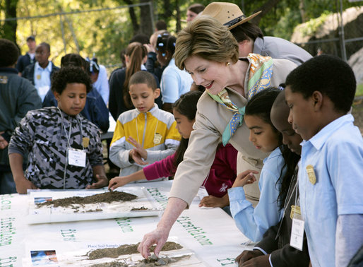Mrs. Laura Bush and children from the Adam Clayton Powell Jr. Elementary School (P.S. 153) and the Boys and Girls Club of Harlem do a 'soil sampling' as part of the First Bloom program at the Hamilton Grange National Memorial in New York City, Sept. 24, 2008. The activity helps children learn about the characteristics of local soil and thus the kinds of plants best suited to the area. The park is the historic home of Alexander Hamilton. White House photo by Chris Greenberg