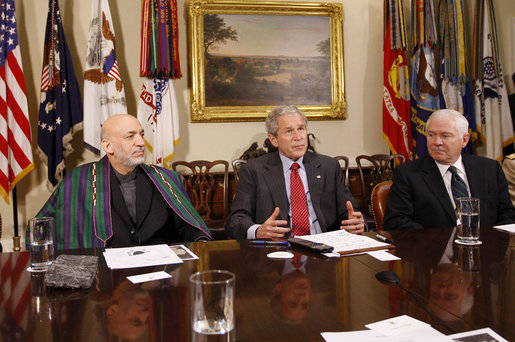 President George W. Bush is joined by President Hamid Karzai of Afghanistan during a video teleconference with U.S. Provincial Reconstruction team leaders, National Guard Agriculture Development team representatives and Afghan governors Friday, Sept. 26, 2008, in the Roosevelt Room at the White House. U.S. Secretary of Defense Robert Gates is seen at right. White House photo by Eric Draper