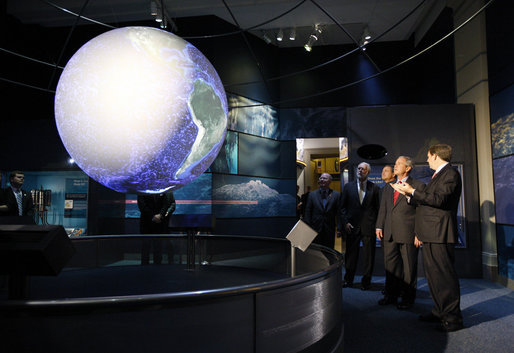 President George W. Bush views a display in the new Sant Ocean Hall as he is escorted by Christian Samper, Director of the Smithsonian Museum of Natural History, right, Friday, Sept. 26, 2008, during his visit to the Smithsonian Museum of Natural History in Washington, D.C. White House photo by Eric Draper