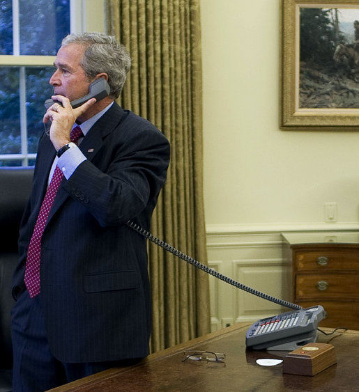 President George W. Bush places phone calls to Congressional members Friday, Sept. 26, 2008, from the Oval Office of the White House as negotiations continued on the financial rescue package. White House photo by Eric Draper