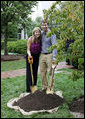 Jenna Hager, daughter of President George W. Bush and Mrs. Laura Bush, and husband Henry Hager pose for a photo after shoveling dirt onto a Cherokee Princess Dogwood during a commemorative tree planting ceremony Saturday, Sept. 27, 2008, on the South Lawn of the White House. White House photo by Joyce N. Boghosian