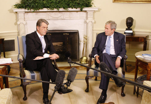 President George W. Bush listens as Ukraine's President Viktor Yushchenko addresses reporters during their meeting in the Oval Office at the White House, Monday, Sept. 29, 2008. White House photo by Eric Draper
