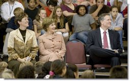 Mrs. Laura Bush enjoys a school assembly program, with Ms. Wilda Lu Nelson, Principal of the Riverside Elementary School, left, and Dr. Thomas Lindsay, Deputy Chairman of the National Endowment for the Humanities, during a visit to the school in Bismarck, N.D., Thursday, Oct. 2, 2008. White House photo by Chris Greenberg