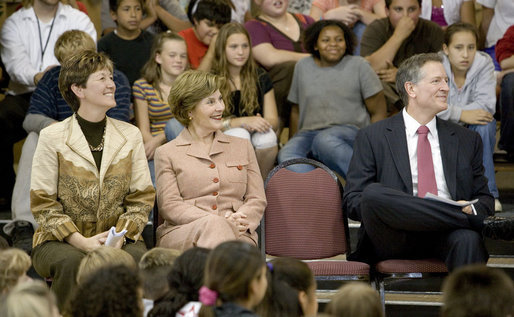 Mrs. Laura Bush enjoys a school assembly program, with Ms. Wilda Lu Nelson, Principal of the Riverside Elementary School, left, and Dr. Thomas Lindsay, Deputy Chairman of the National Endowment for the Humanities, during a visit to the school in Bismarck, N.D., Thursday, Oct. 2, 2008. White House photo by Chris Greenberg