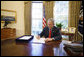 President George W. Bush signs the Emergency Economic Stabilization Act of 2008 in the Oval Office Friday, Oct. 3, 2008, at the White House. White House photo by Eric Draper