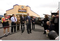 President George W. Bush and Mrs. Laura Bush are joined by local small business leaders for remarks on the economy Monday, Oct. 6, 2008, outside Olmos Pharmacy in San Antonio, Texas.  White House photo by Eric Draper