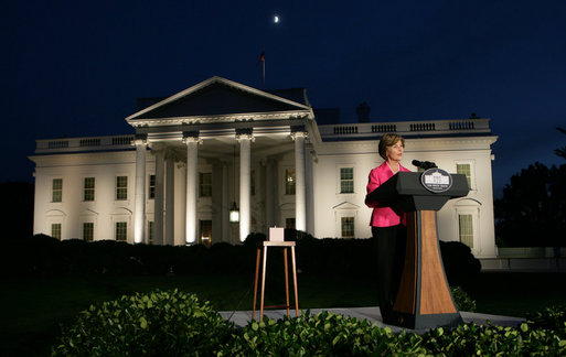 Mrs. Laura Bush prepares to push the button, Oct. 7, 2008, to light up the White House in a pink glow as part of Breast Cancer Awareness. Preventing and curing breast cancer is a cause that Mrs. Bush has worked toward around the world. White House photo by Chris Greenberg