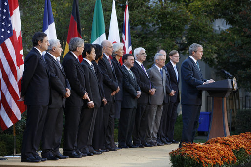 President George W. Bush delivers remarks after meeting with G7 finance ministers and heads of international finance institutions, Saturday morning, Oct. 11, 2008, in the Rose Garden at the White House. Pictured with President Bush from left to right are, Chairman of the Financial Stability Forum Mario Draghi, IMF Managing Director Dominique Strauss-Kahn, Eurogroup Chairman and Prime Minister of Luxembourg Jean-Claude Juncker, Japan's Finance Minister Soichi Nakagawa, Secretary of State Condoleezza Rice, Treasury Secretary Henry Paulson, France's Finance Minister Christine LeGarde, Canada's Finance Minister Jim Flaherty, Britain's Chancellor of the Exchequer Alister Darling, Italy's Economy Minister Giulio Tremonti, Germany's Finance Minister Peer Steinbruck and World Bank President Robert Zoellick. White House photo by Eric Draper