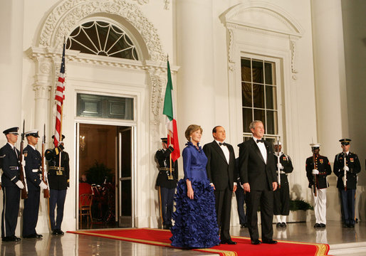 President George W. Bush and Mrs. Laura Bush welcome Italian Prime Minister Silvio Berlusconi Monday evening, Oct. 13, 2008, to the North Portico of the White House for a State Dinner in his honor. White House photo by Joyce N. Boghosian