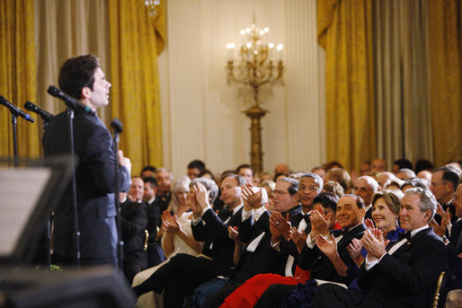 President George W. Bush and Mrs. Laura Bush are joined by Italian Prime Minister Silvio Berlusconi Monday evening, Oct. 13, 2008, as they listen to the Broadway cast of the Jersey Boys perform in the East Room of the White House. White House photo by Eric Draper
