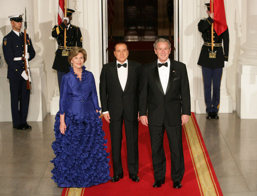 President George W. Bush and Mrs. Laura Bush welcome Italian Prime Minister Silvio Berlusconi Monday evening, Oct. 13, 2008, to the North Portico of the White House for a State Dinner in his honor. White House photo by Chris Greenberg