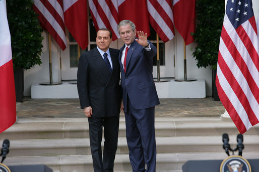 President George W. Bush and Italian Prime Minister Silvio Berlusconi stand together following their remarks at a joint press availability Monday, Oct. 13, 2008, at the White House. President Bush said, "I want to thank you for giving the American People the honor of celebrating Columbus Day with the leader of Italy." White House photo by Chris Greenberg