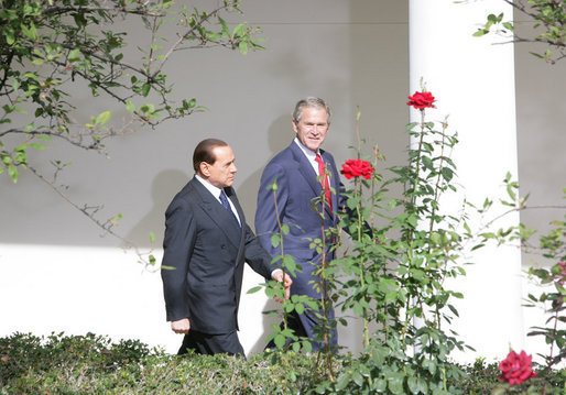 President George W. Bush and Italian Prime Minister Silvio Berlusconi walk together Monday, Oct. 13, 2008 along the West Wing Colonnade, following their joint press availability in the White House Rose Garden. White House photo by Chris Greenberg