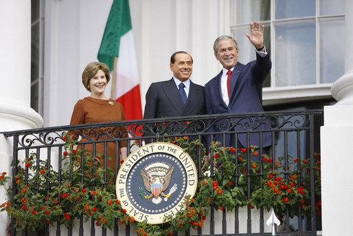 President George W. Bush andMrs. Laura Bush stand with Italian Prime Minister Silvio Berlusconi on the balcony of the South Portico of the White House Monday, Oct. 13, 2008, during Prime Minister Berlusconi's official welcome to the White House. White House photo by Eric Draper