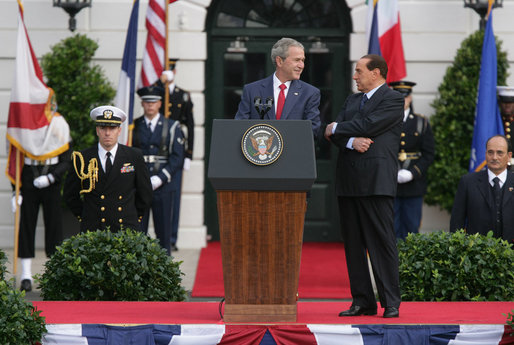 President George W. Bush delivers his remarks welcoming Prime Minister Silvio Berlusconi of Italy upon his arrival Monday, Oct. 13, 2008, during a South Lawn Arrival Ceremony for Prime Minister Silvio Berlusconi of Italy at the White House. The President said during his remarks, "With the visit today of Prime Minister Berlusconi, we reaffirm the close and trusting friendship between our two countries. For more than six decades, America and Italy have been partners in the work of freedom and progress. We look to the future with confidence." White House photo by Chris Greenberg