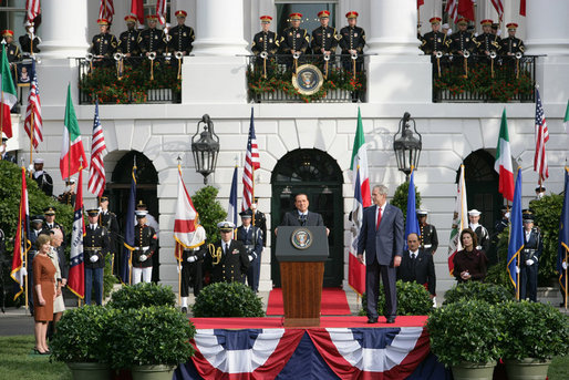 President George W. Bush listens as Prime Minister Silvio Berlusconi of Italy addresses his remarks Monday, Oct. 13, 2008, during ceremonies on the South Lawn to welcome Prime Minister Berlusconi to the White House. White House photo by Chris Greenberg