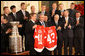 President George W. Bush stands with Detroit Red Wings captain Nicklas Lidstrom as they hold up jerseys Tuesday, Oct. 14, 2008 in the East Room at the White House, representing President Bush's father 41 and the President 43, during the ceremony to honor the Red Wings 2008 Stanley Cup championship. White House photo by Chris Greenberg