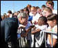 President George W. Bush shakes hands with a young boy as he arrives at Alexandria International Airport - Air National Guard Base Monday, Oct. 20, 2008, in Alexandria, Louisiana. White House photo by Chris Greenberg