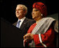 President George W. Bush stands with Liberian President Ellen Johnson Sirleaf before delivering his remarks at the White House Summit on International Development Tuesday, Oct. 21, 2008, in Washington, D.C. President Bush discussed in his remarks core transformational goals of country ownership, good governance, results-based programs and accountability, and the importance of economic growth. White House photo by Eric Draper