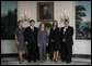 Mrs. Laura Bush poses Oct. 21, 2008 with the U.S. National Commission for UNESCO Laura W. Bush Traveling Fellows in the Diplomatic Reception Room of the White House. From left are Laura Olsen, David Lee, Heather McGee and Michael Aguilar. White House photo by Joyce N. Boghosian