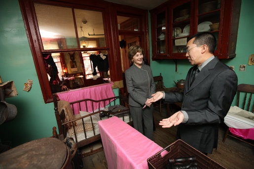 Mrs. Laura Bush visits the Lower East Side Tenement Museum in New York City, Friday, Oct 24, 2008. The tour is led by Mr. David Eng, the museum's Vice President of Public Affairs. The visit was to highlight the importance of historical preservation and celebrate the role immigration has played in America. White House photo by Chris Greenberg