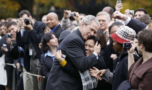 President George W. Bush embraces an employee of the Executive Office of the President Thursday, Nov. 6, 2008, after delivering remarks to his staff on the upcoming transition. Said the President, "Over the next 75 days, all of us must ensure that the next President and his team can hit the ground running.' White House photo by Eric Draper