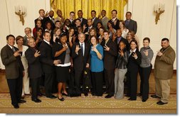 President George W. Bush poses with members of the Arizona State University Men's and Women's Track Team Wednesday, Nov. 12, 2008, during a photo opportunity with 2008 NCAA Sports Champions at the White House.  White House photo by Eric Draper