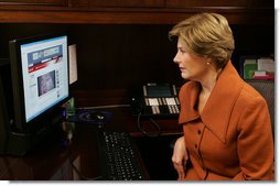 Mrs. Laura Bush, as part of her briefing Thursday, Nov. 13, 2008 on the acid attack against young women on their way to school Wednesday in Kandahar, Afghanistan, reviews press footage about the incident in the East Wing at the White House.  White House photo by Joyce N. Boghosian