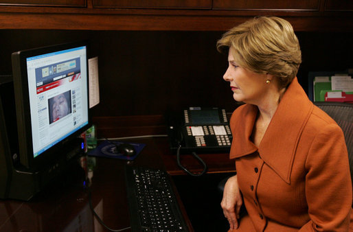 Mrs. Laura Bush, as part of her briefing Friday, Nov. 14, 2008 on the acid attack against young women on their way to school Wednesday in Kandahar, Afghanistan, reviews press footage about the incident in the East Wing at the White House. White House photo by Joyce N. Boghosian