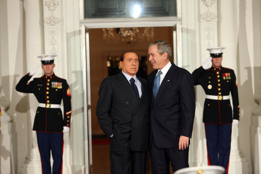 President George W. Bush greets Italy's Prime Minister Silvio Berlisconi Friday, Nov. 14, 2008, upon his arrival for dinner with Summit on Financial Markets and the World Economy Leaders at the White House White House photo by Chris Greenberg