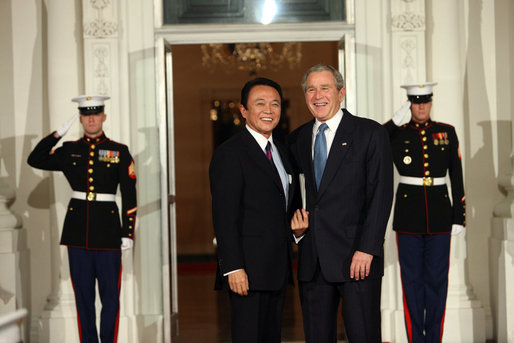 President George W. Bush greets Prime Minister of Japan Taro Aso Friday, Nov. 14, 2008, upon his arrival for dinner with Summit on Financial Markets and the World Economy Leaders at the White House. White House photo by Chris Greenberg