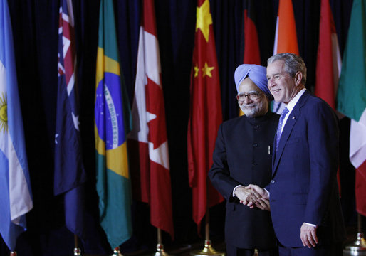 President George W. Bush welcomes Prime Minister Manmohan Singh of India, to the Summit on Financial Markets and the World Economy Saturday, Nov. 15, 2008, at the National Building Museum in Washington, D.C. White House photo by Eric Draper