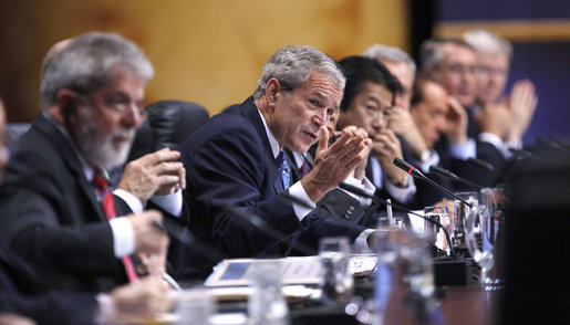 President George W. Bush gestures as he addresses the G20 leaders and delegates during the first Plenary Session I at the the Summit on Financial Markets and the World Economy Saturday, Nov. 15, 2008, at the National Building Museum in Washington, D.C. White House photo by Eric Draper