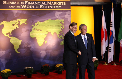 President George W. Bush welcomes World Bank President Robert B. Zoellick to the Summit on Financial Markets and the World Economy Saturday, Nov. 15, 2008, at the National Building Museum in Washington, D.C. White House photo by Chris Greenberg