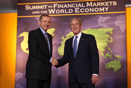President George W. Bush welcomes Prime Minister Recep Tayyip Erdogan of Turkey to the Summit on Financial Markets and the World Economy Saturday, Nov. 15, 2008, at the National Building Museum in Washington, D.C. White House photo by Chris Greenberg